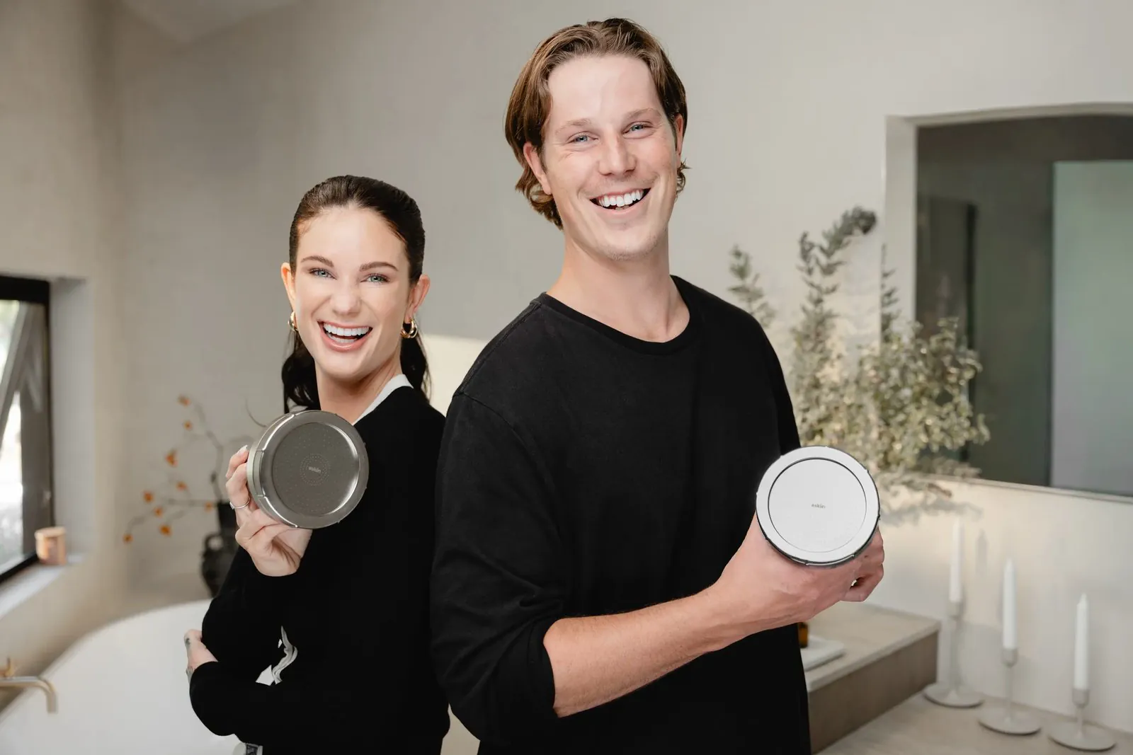 Wes and Maddie holding the eskiin showerhead